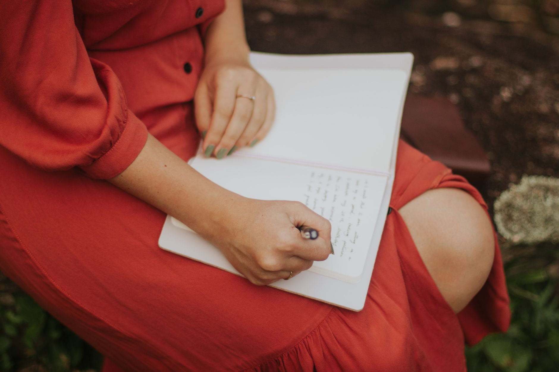Travel writer with notebook in highland sanctuary